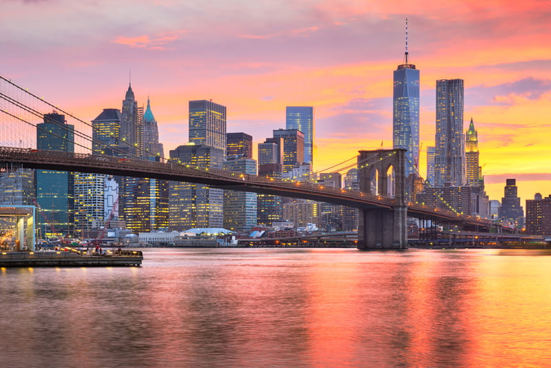 New York, New York, USA Lower Manhattan skyline on the East River at dusk.