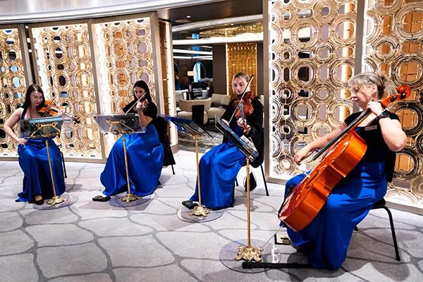 Musicians in the Atrium of Oceania's Allura Shakedown Voyage