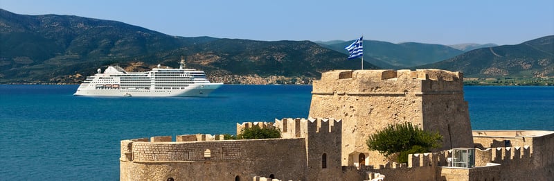 Silversea Cruises anchored in Nafplion, Greece in the Mediterranean sea - Silversea vs Regent Seven Seas Which Luxury Cruise Line
