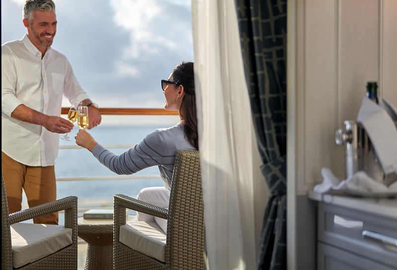 Oceania Cruises Veranda Stateroom Lifestyle Couple with Champange - First Look The Reinspiration of Oceania Marina