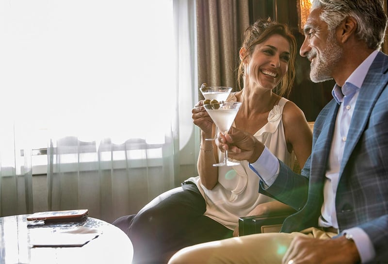 Man-and-woman-on-Regent-Seven-Seas-Cruises-in-Horizon-Lounge-Regent-Cruise-Dress-Code-Guide