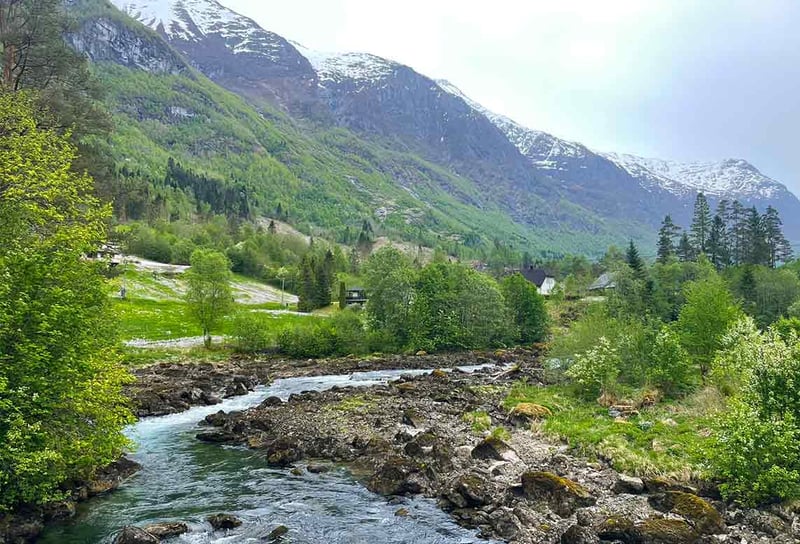 Scenic-view-of-Norwegien-mountatin-with-snow-on-Norwegian-Fjords-on-QM2-What-to-Expect
